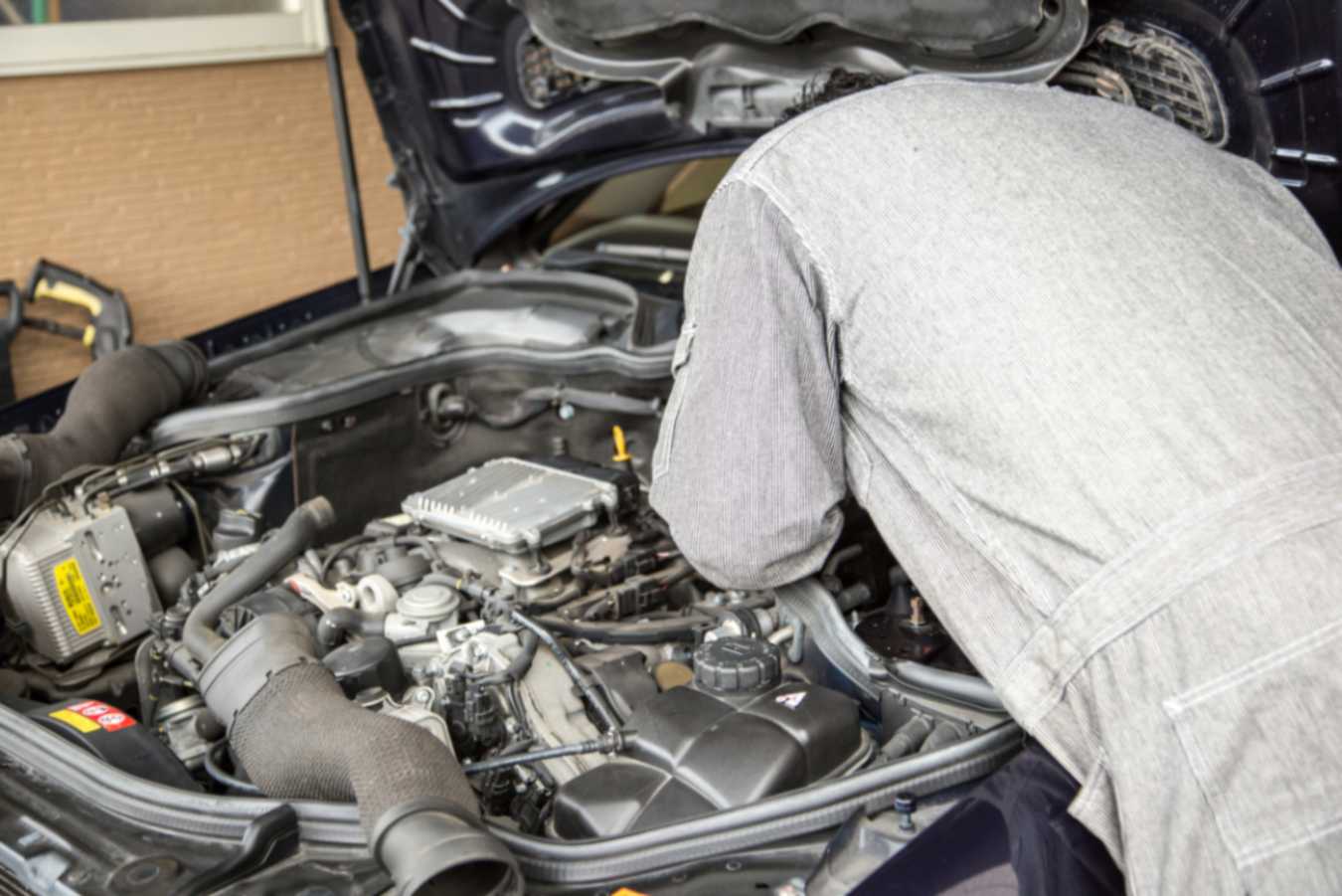 Mechanic repairing BMW